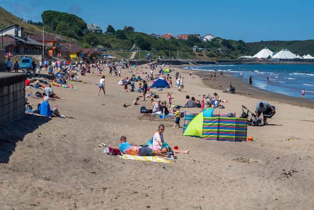 Beach-goers enjoy Scarborough's North Bay in June 2020.