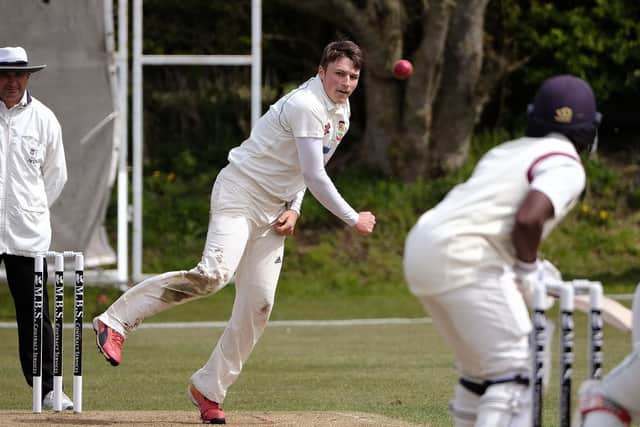 Elliot Hatton, in bowling action, top-scored with the bat for Flixton