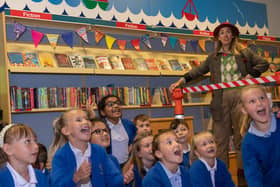 Children and the Professor watch with delight as Time Traveller arrives