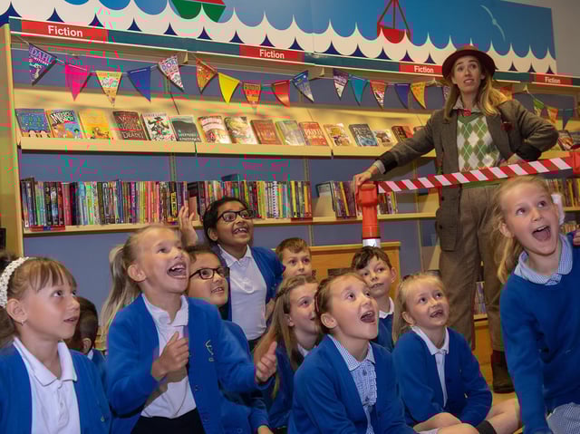 Children and the Professor watch with delight as Time Traveller arrives