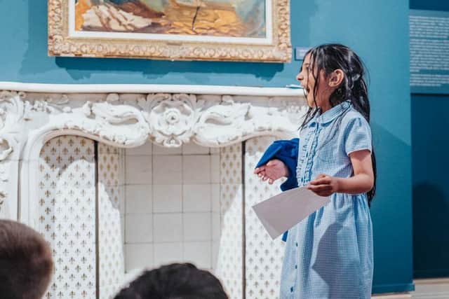 A Schoolgirl finds a secret message from the Professor in the fire place at the Art Gallery (Picture: Stewart Baxter)