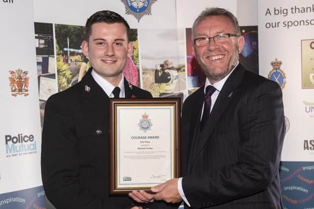 Sergeant Tinsley receiving his Gold Courage Award from Mike Stubbs of The Police Federation. Picture: North Yorkshire Police