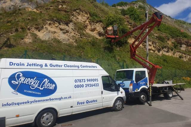 Squeeky Clean removing the armchair from the headland. Picture: Mick Couzens