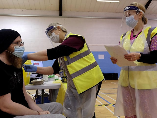Tom Pickup gets his vaccination at the Rugby Club.