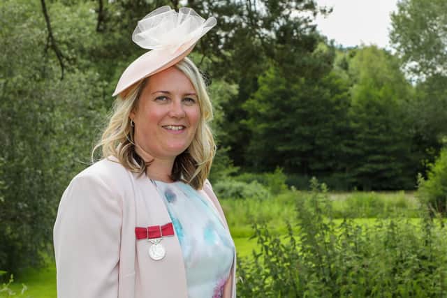 Donna Loveland with her British Empire Medal.