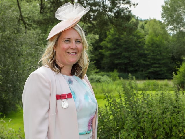 Donna Loveland with her British Empire Medal.