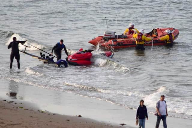 Scarborough RNLI towed the sinking jet ski back to shore in the North Bay.