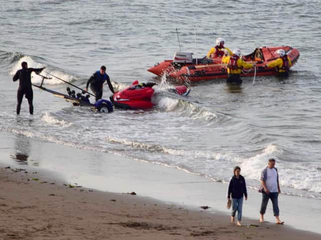 Scarborough RNLI towed the sinking jet ski back to shore in the North Bay.