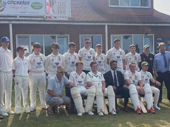 The Folkton & Flixton CC team line up with Kumar Sangakkara