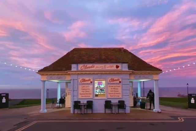 Clara's Coffee Shop, Whitby, against a pink sky backdrop.