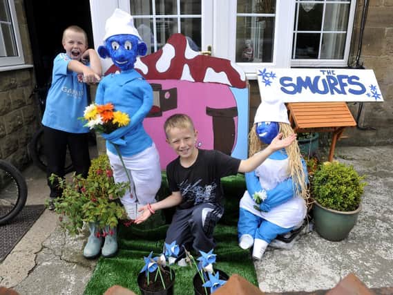 Hinderwell Gala Week Scarecrow Festival: Connal Gibson, centre, with friend Matthew Pullman and their Smurfs.