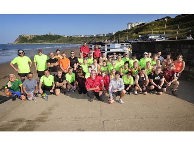 The Run Scarborough group. Front left, Mountain Rescue Incident Controller Ian Hugill with running organiser Paul Sutherns, right. (JPI Media/ Richard Ponter)