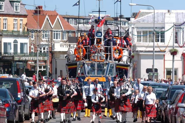 The RNLI Volunteer Lifeboat crew ride through Bridlington, pulled by the special tractor, before launching into the sea at Bridlington. The parade followed a special service at Bridlington Priory. Does anyone know what year this event took place?