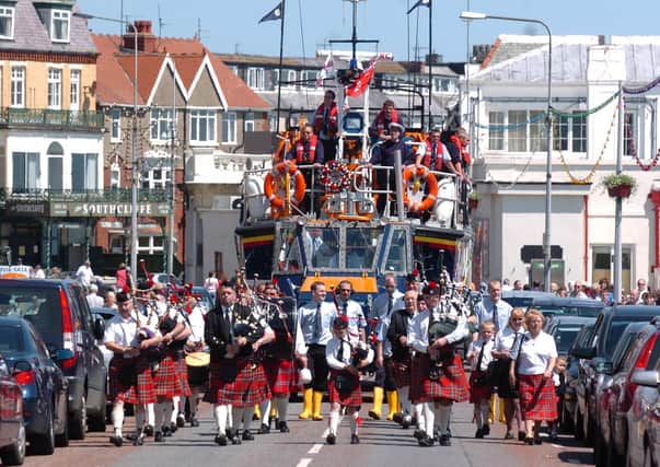The RNLI Volunteer Lifeboat crew ride through Bridlington, pulled by the special tractor, before launching into the sea at Bridlington. The parade followed a special service at Bridlington Priory. Does anyone know what year this event took place?