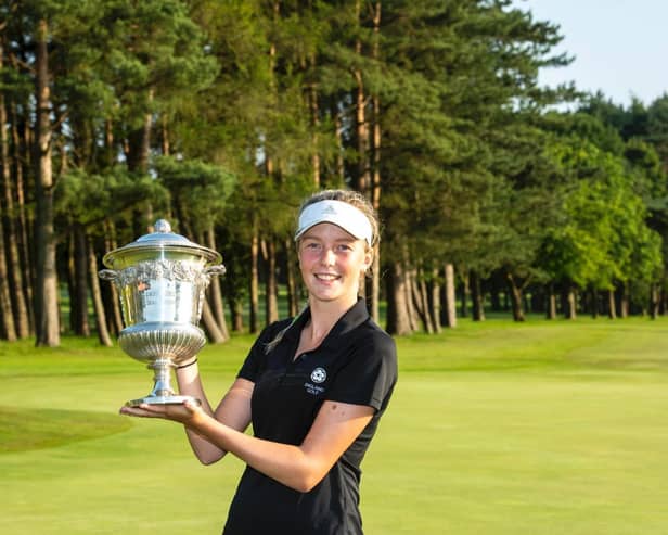 Patience Rhodes holds aloft the silverware at Malton & Norton GC

Photo -Leaderboard Photography)