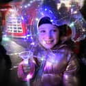 A youngsters enjoys the lantern parade at a previous Whitby Christmas Festival.