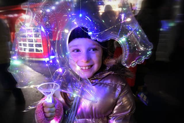 A youngsters enjoys the lantern parade at a previous Whitby Christmas Festival.
