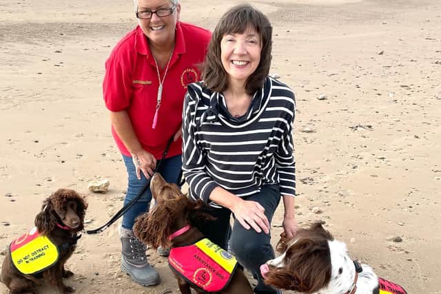 Glenda Young and Lynn Stacey with assistance dogs.
