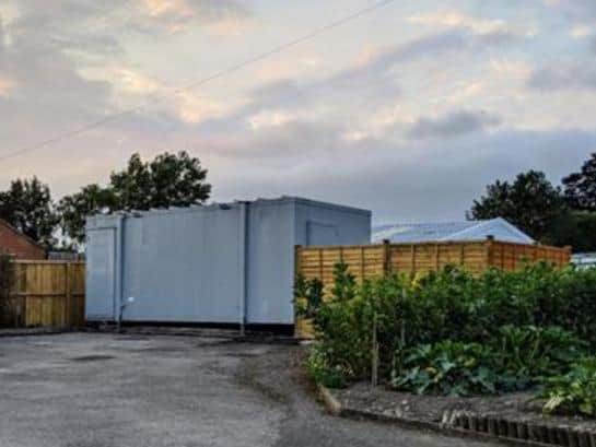 The man has been ordered to remove the shipping container.