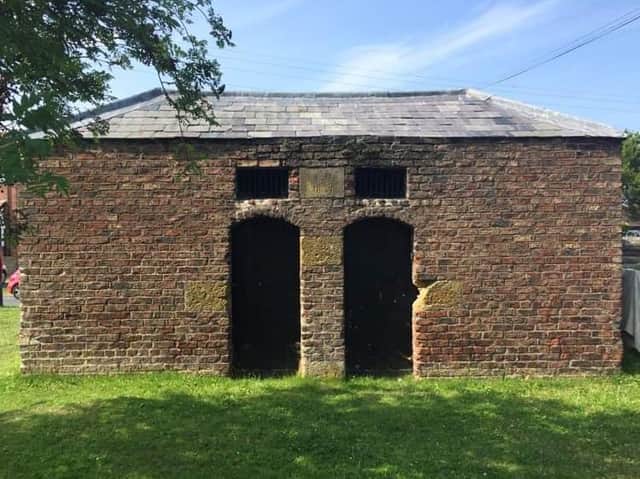 The tiny red-brick lock-up nicknamed the black hole