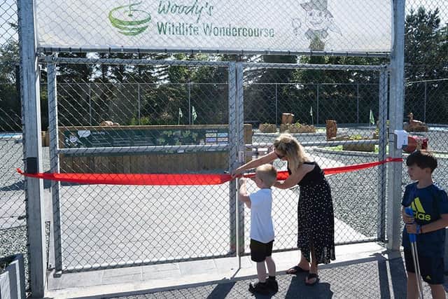 Airy Hill School pupil Lucas Leighton came up with the winning name of Woody’s Wildlife Wondercourse - here he cuts the ribbon.