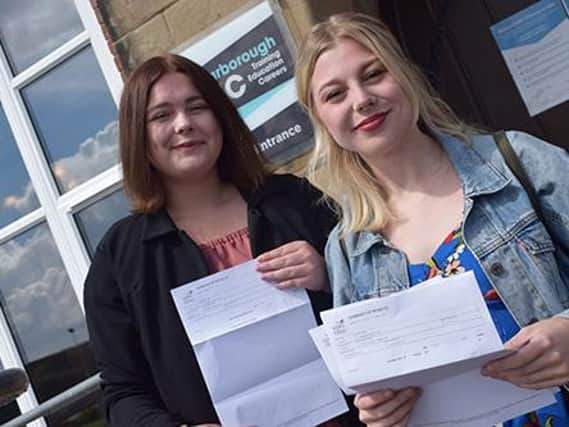 Lucy Purnell and Christina Rumbelow, both 18, pictured celebrating their outstanding A Level results following completion of their studies on Scarborough TEC's new Crime & Society Academy.