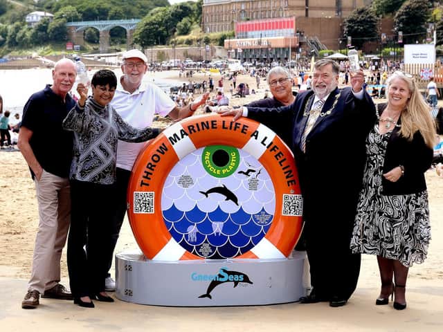 Councillors, campaigners and Mayor Eric Broadbent welcome the new GreenSeas recycling bin in the South Bay.