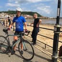 Cathy Wood on her 1,000-mile bike ride fundraiser on Foreshore Road in Scarborough. (Photo: KD Recruitment)