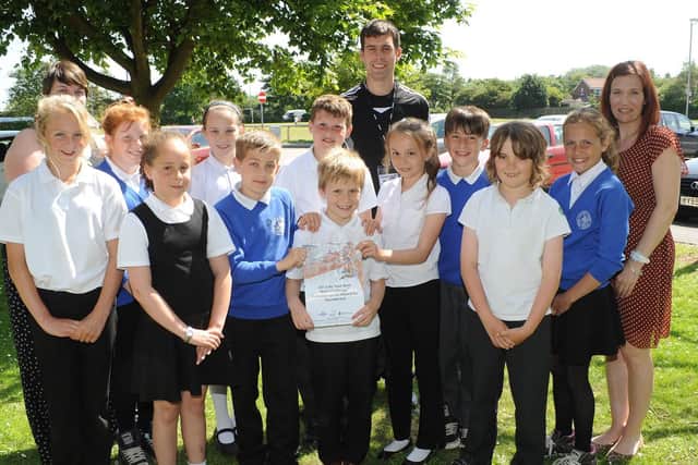 Hilderthorpe Primary School celebrates winning the Rock Challenge Best Sound Track award in 2013. Do you recognise any of the people in the picture? Photograph taken by Paul Atkinson. (NBFP PA1328-12b)