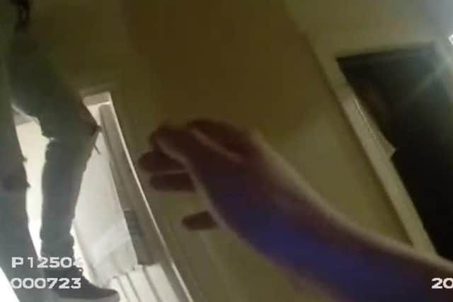 Police photo shows an illegal house party, with a man’s legs dangling from the entrance to a loft. (North Yorkshire Police)