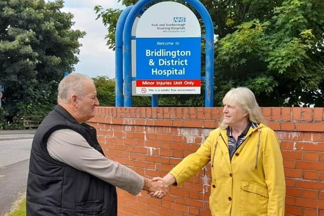 Mick Pilling and Jayne Phoenix shake hands at the hand-over of the ‘Save Bridlington Hospital’ campaign.