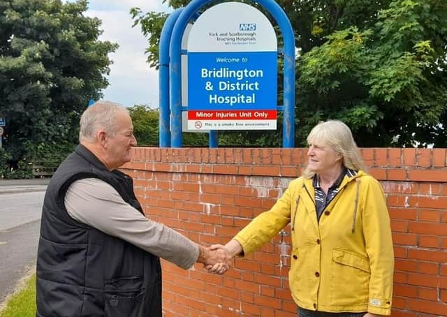 Mick Pilling and Jayne Phoenix shake hands at the hand-over of the ‘Save Bridlington Hospital’ campaign.