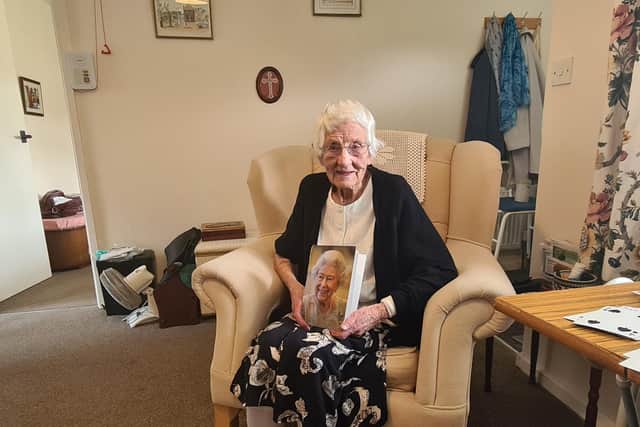 Alive Gullon, 100, from Sleights, with her card from the Queen.