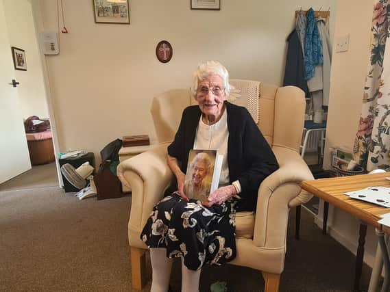 Alive Gullon, 100, from Sleights, with her card from the Queen.