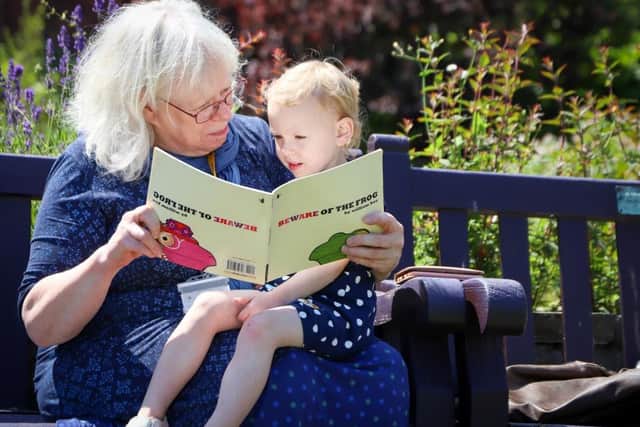 CU Scarborough tutor Jane Gill reads to her granddaughter Amelia Teddy Shepherd at the storytelling event. (CU Scarborough)