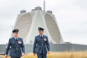 Wing Commander Al Walton with new Station Commander, Thom Colledge, walking from the radar at RAF Fylingdales.