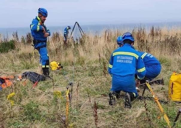 The coastguard teams carried out a cliff rescue using newly qualified specialist technicians and brought all four and their dog to safety.