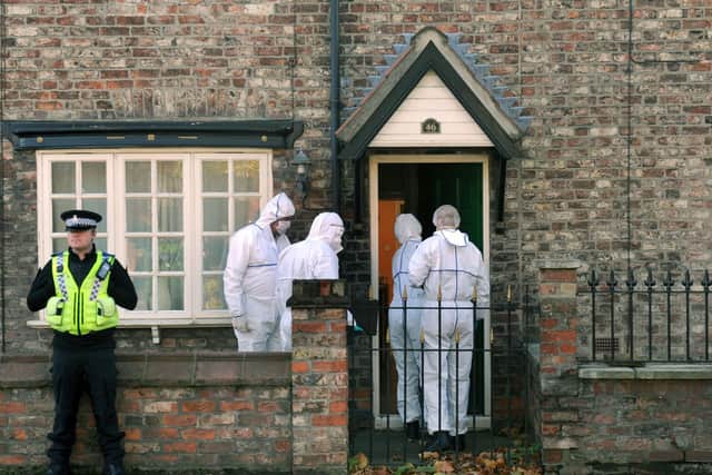 Forensics officers at Claudia's house. (JPI Media)