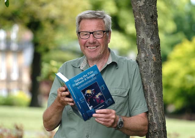David Adamson is pictured with his book Taking The Tide Where It Serves.