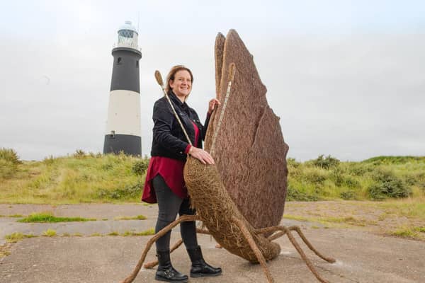 Whitby artist Emma Stothard with her butterfly sculpture, unveiled at Spurn Point.