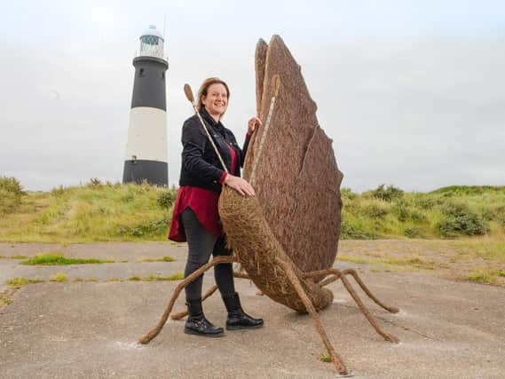 Whitby artist Emma Stothard with her butterfly sculpture, unveiled at Spurn Point.