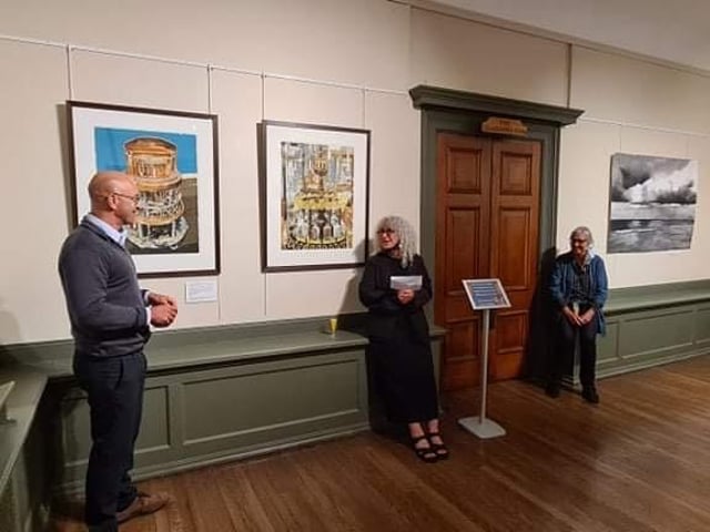 Professor Sean Paling (left) explains Dark Matter at the opening of Coastal at Whitby's Pannett Art Gallery; also pictured are exhibiting artists Hannah (centre) and Jo (right) Chesterman.