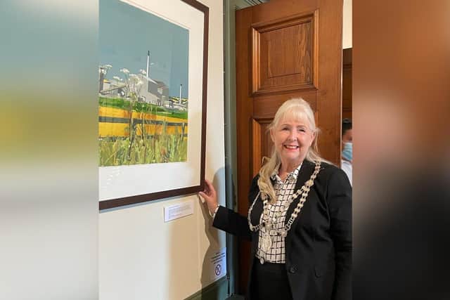 Mayor of Whitby, Cllr Linda Wild, at the opening of the Coastal exhibition at Whitby's Pannett Art Gallery. She is looking at the painting, A Quiet Place in the Universe, by Hannah Chesterman, which features Boulby mine.
