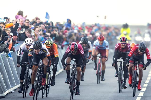 Alexander Kamp, Riwal Readynez, wins the sprint in North Bay on Marine Drive from Chris Lawless, Team Ineos, in 2019.
