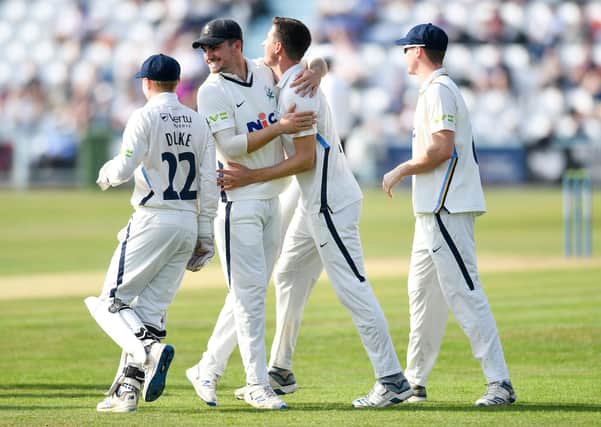 Yorkshire's Matt Fisher celebrates the wicket of Somerset's Azhar Ali with team-mate Jordan Thompson Picture by Will Palmer/SWpix.com
