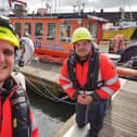 Chris Warren and Neil MacInnes spotted the boy clinging to a pontoon.