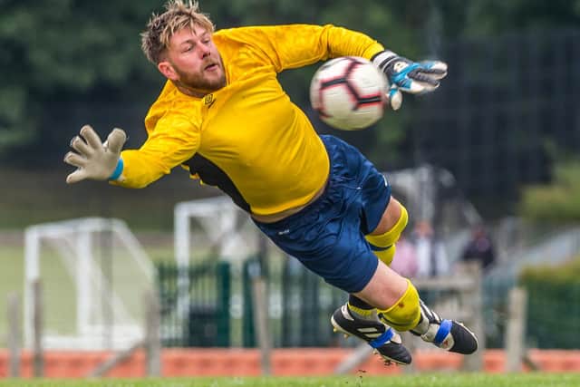 Davey Welham makes a flying stop to Whitby Fishermen
Photo by Brian Murfield