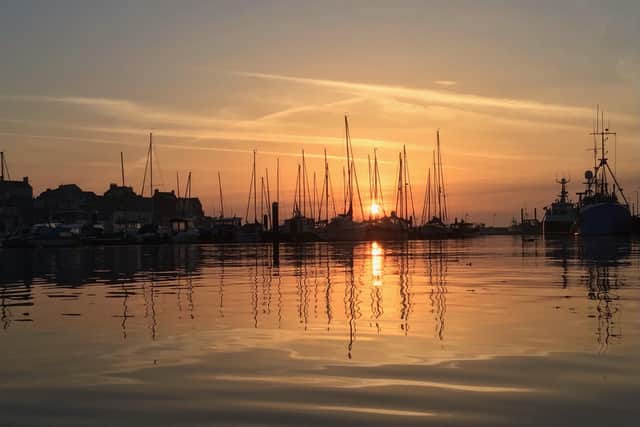 Tony Pockley sent in this stunning Bridlington Harbour photograph brimming with yellow and orange hues.