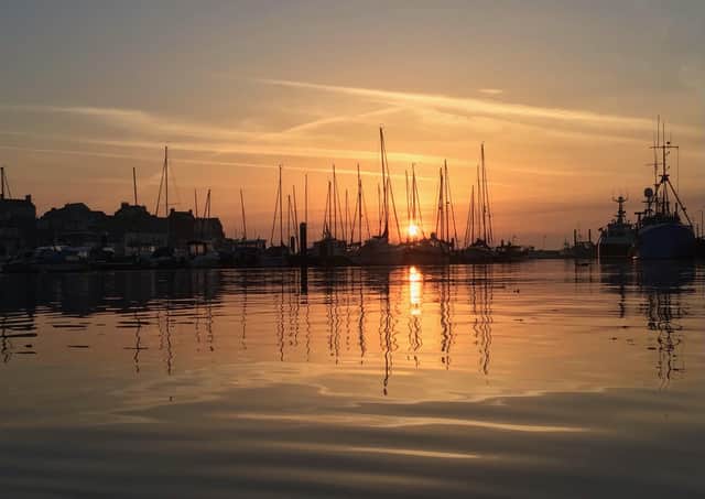 Tony Pockley sent in this stunning Bridlington Harbour photograph brimming with yellow and orange hues.