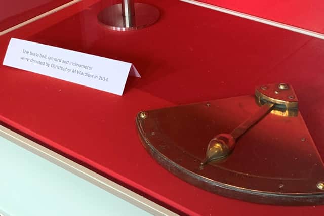 The inclinometer and card mentioning Mr Wardlow.